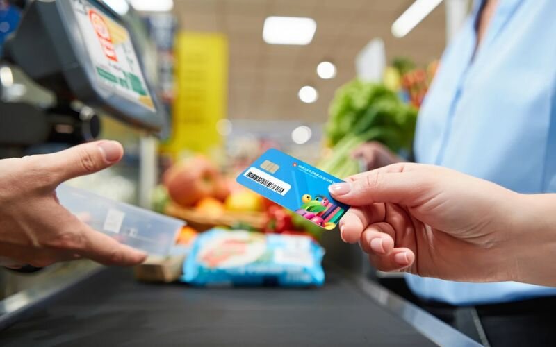 Grocery rewards cards offer cashback or points, turning everyday purchases into savings